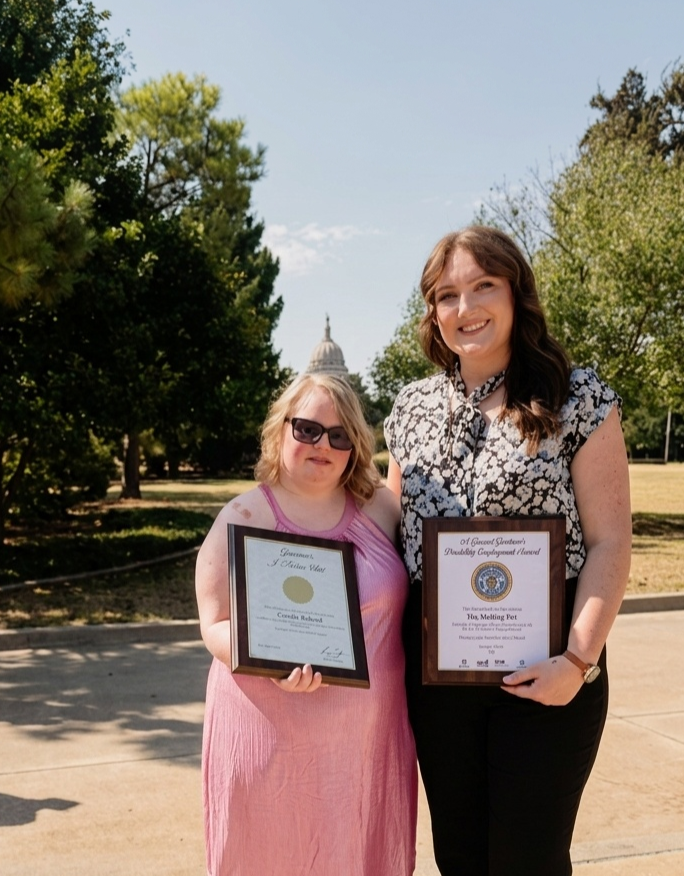 Cyanna and The Melting Pot manager holding their Governor's Disability Employment Awards